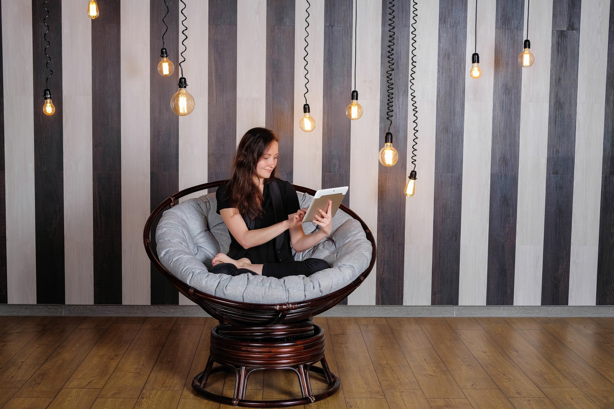 A woman practicing yoga and reading a book